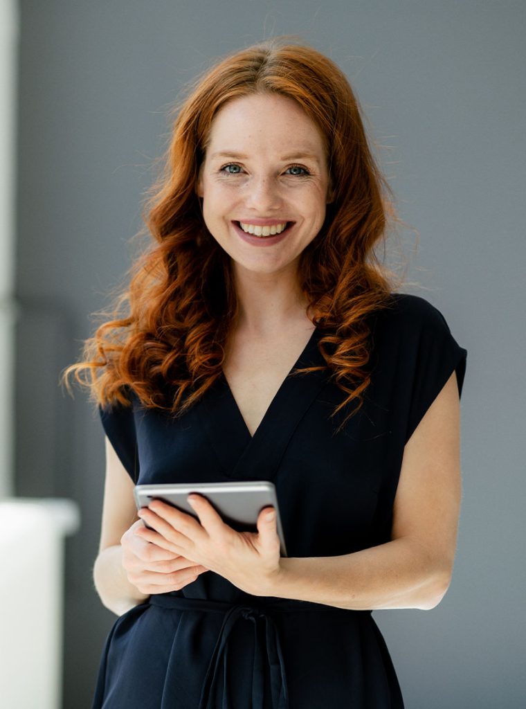 portrait-of-content-redheaded-businesswoman-with-d-EYLN464.jpg